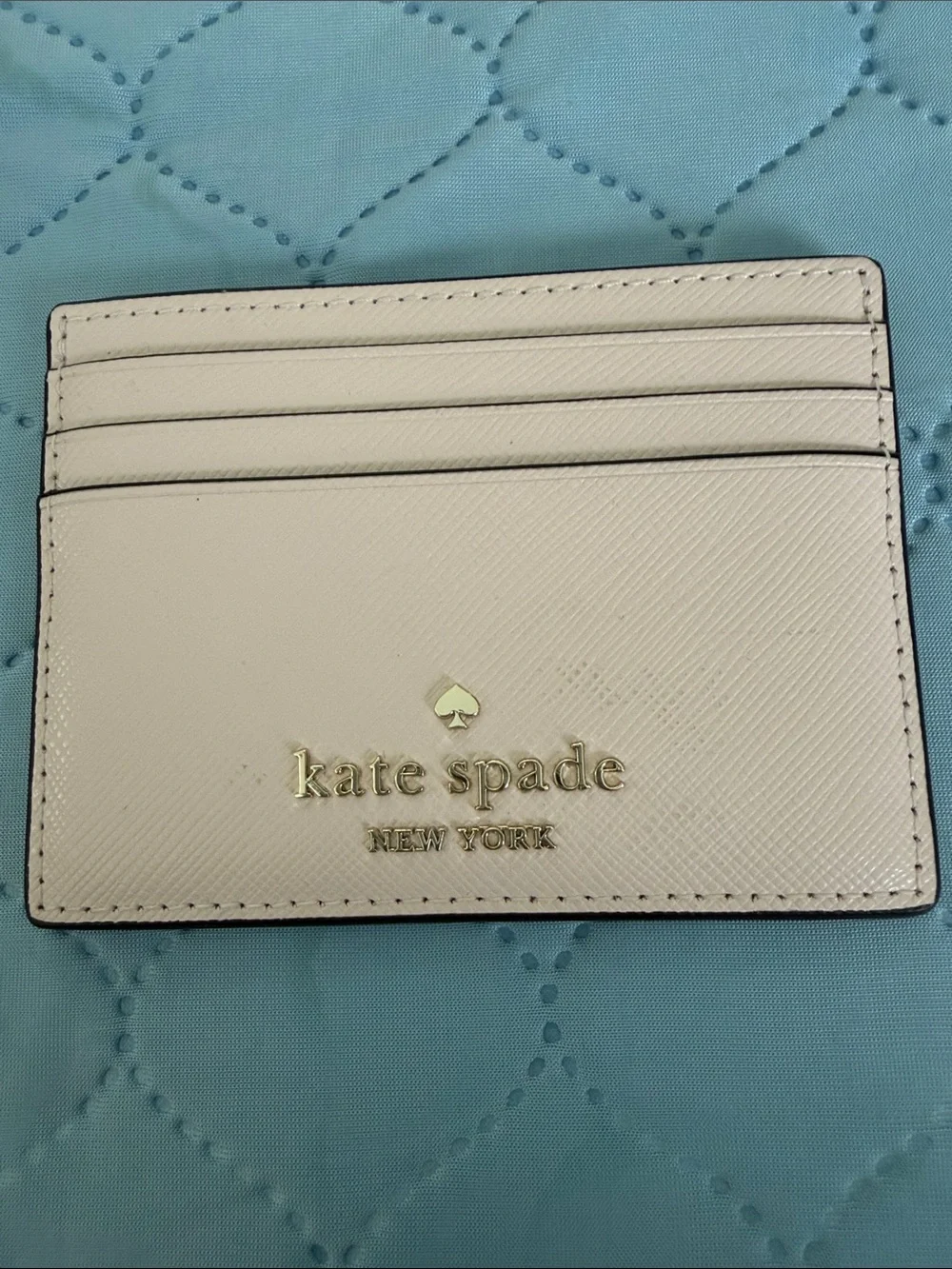 kate spade light pink leather card case with gold logo